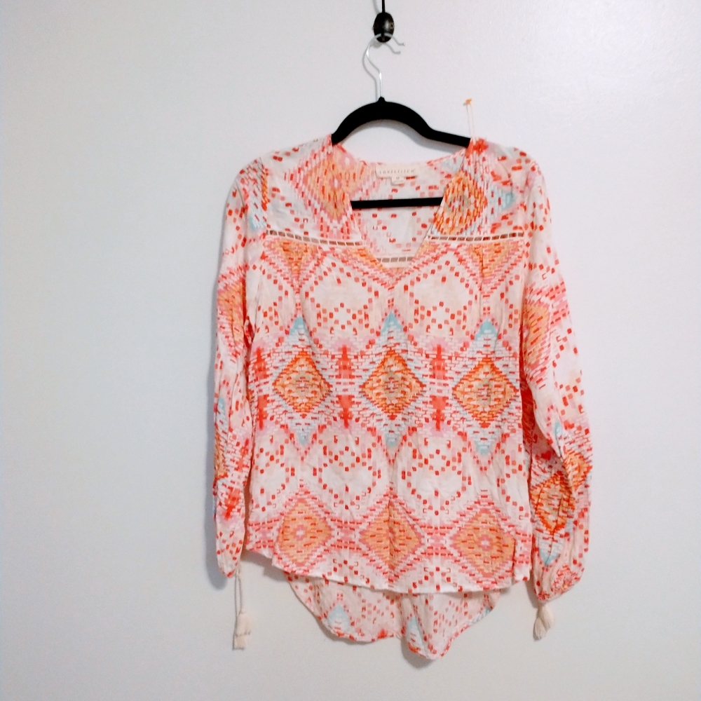 Love Stitch from stick fix white long sleeve top with orange pattern.  Boho peas